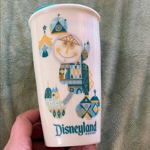 Disneyland Starbucks Travel Mug with Mickey Mouse and Small World details